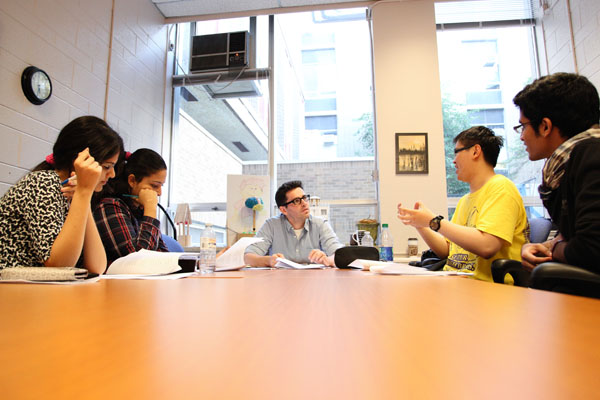 Students and instructor at a group meeting.